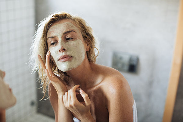 image of a woman using peel off beauty face mask