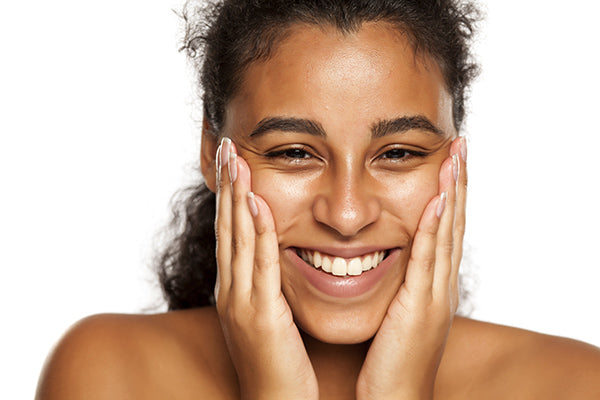Image of Woman having applied conditioning gel to even out skin tone