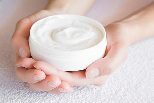 Image of moisturiser cream in a pot for face and body