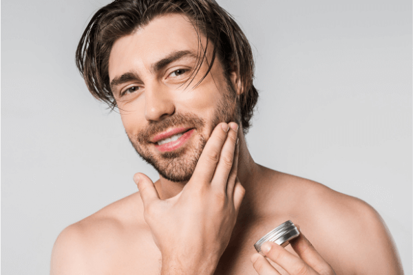image of a man being applied beard balm