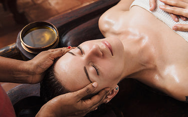 Image of woman getting a massage using classic massage oil blend