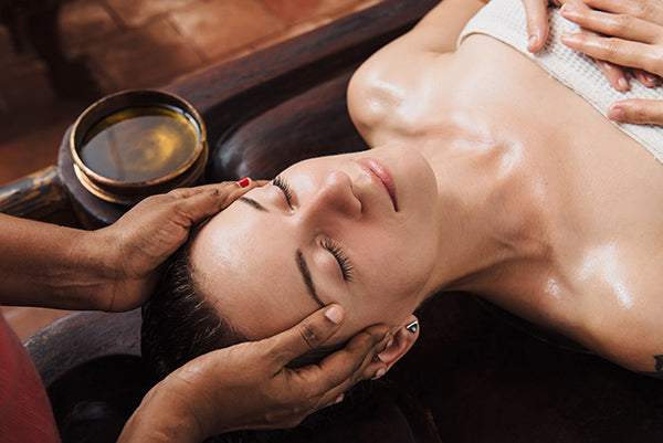 Image of woman getting a massage using classic massage oil blend