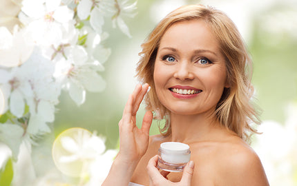 Image o a woman holding a jar of daily moisturiser