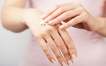 Image of a person using deep conditioning hand cream