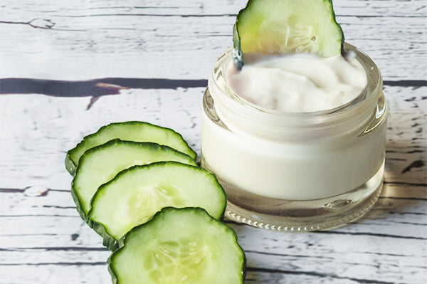 Image of lifting eye gel in a jar with cucumber slices