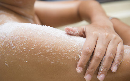 Image of Woman using Rinse Off Scrub Cleanser