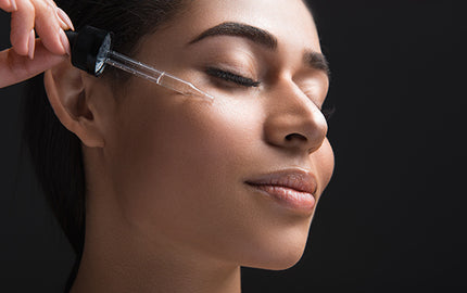 Image of Woman applying Safflower Face Oil on her Skin