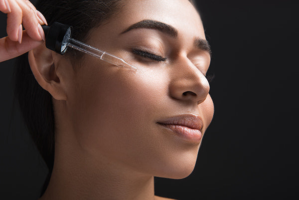 Image of Woman applying Safflower Face Oil on her Skin