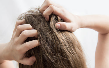 Image of Woman Scratching her Scalp suitable for Scalp Serum