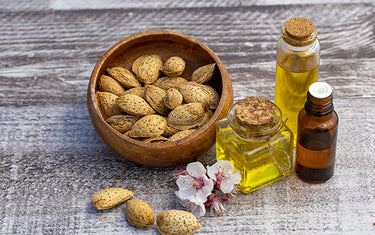 Images of almond seed and Sweet almond oil for stretch mark oil