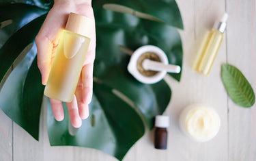 Image of a Person holding a bottle of Vitamin Bath and Spa Products