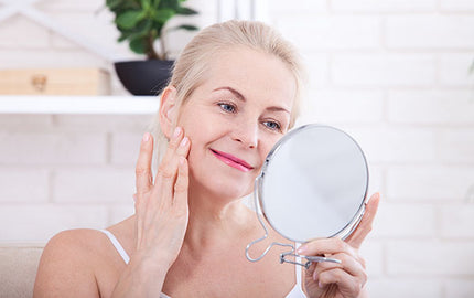 image of a woman using age defying oil serum