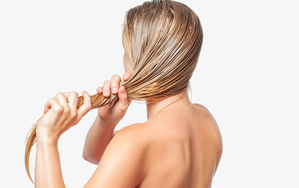 Image of woman doing a hair mask using organ hair conditioner