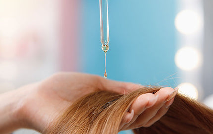 Image of shea and argan hair conditioner being applied on hair