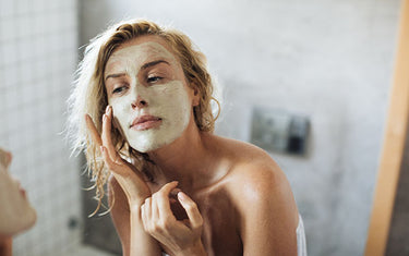 image of a woman using peel off beauty face mask