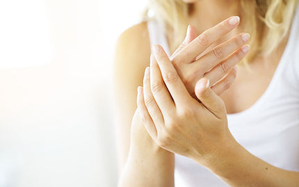 image of woman using calendula hand cream