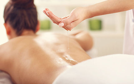 image of massage being done with chickweed and chamomile massage oil