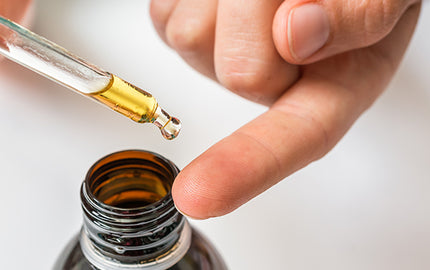 image of someone applying hemp seed cuticle cure oil