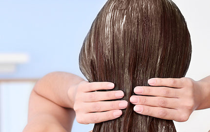 image of a woman using the everyday shampoo