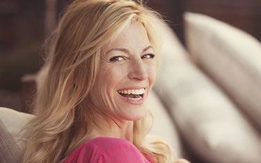 Image of woman laughing with healthy hair