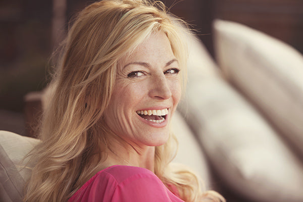Image of woman laughing with healthy hair