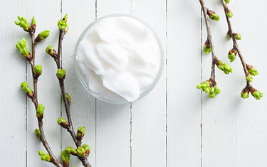 Image of a jar containing lightly lifting body lotion