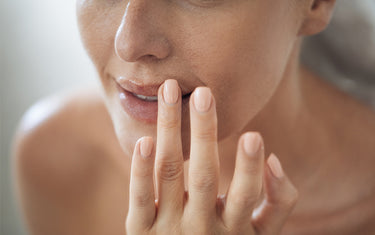 image of someone applying lip balm with cocoa butter