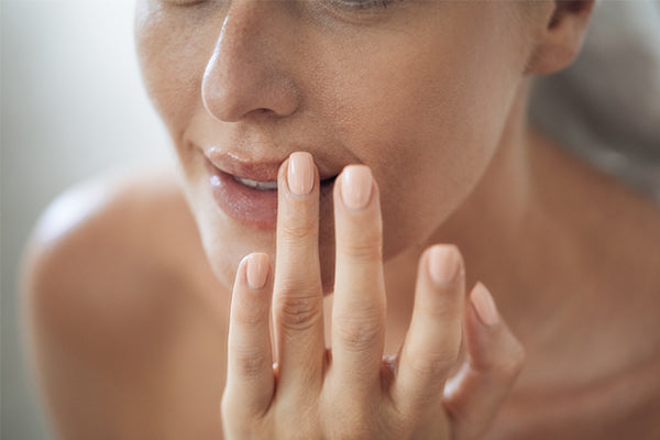 image of someone applying lip balm with cocoa butter