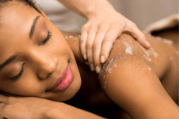 image of oriental exfoliating body scrub being use during a massage