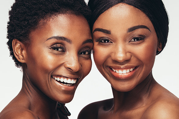 image of woman with dark skin looking happy